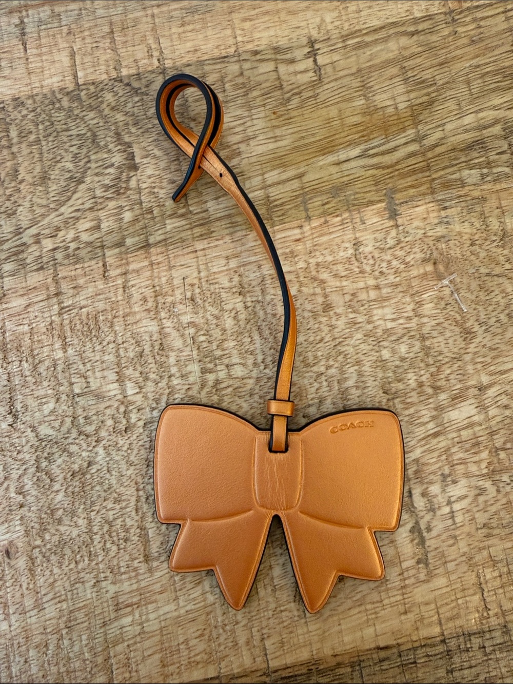 Coach Orange Leather Bow Tag